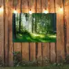 Zonnestralen in een groen bos tuinposter los doek groot -sfeer1